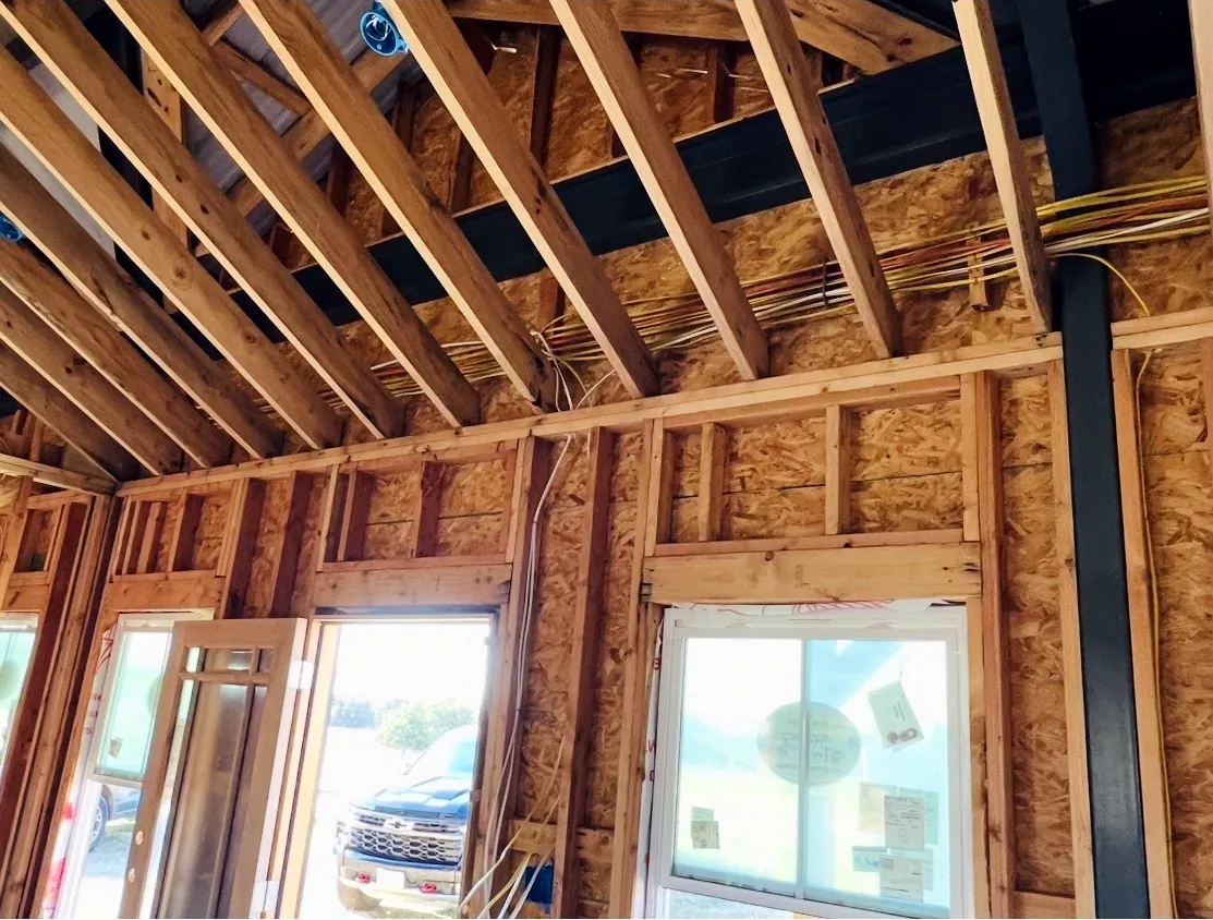 Electrical rough-in wiring run along the framing of a new building